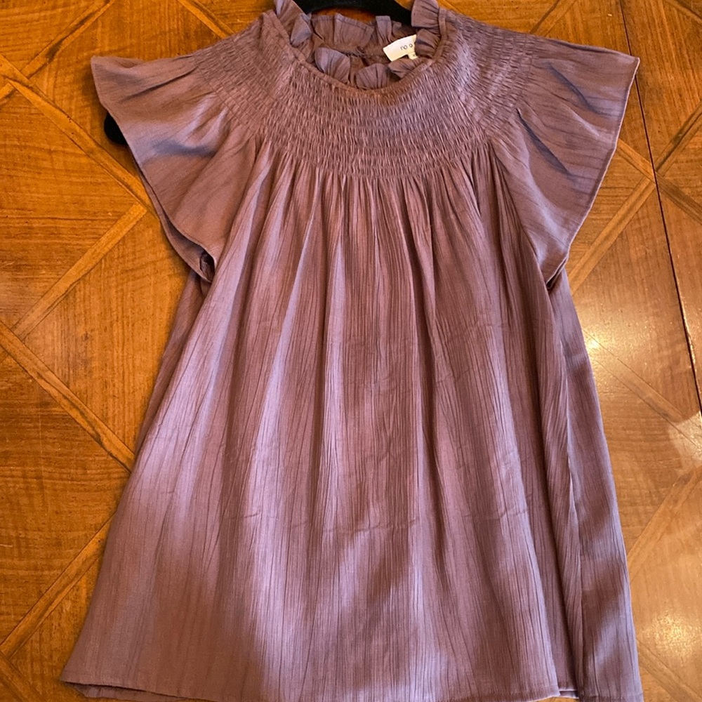 Pretty plum maroon-ish color Angel wing top. Sz XS